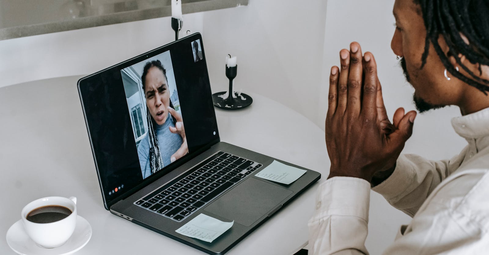 Anxious misunderstanding African American couple having video call via laptop and arguing emotionally while going through relationships crisis