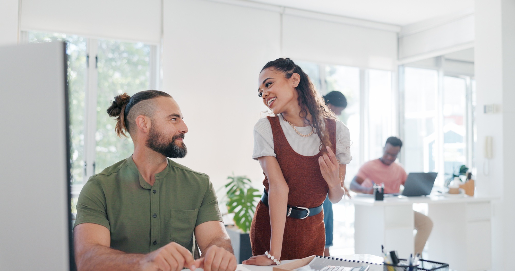 Flirting, laughing and talking business people at work, funny conversation and happiness in an offi