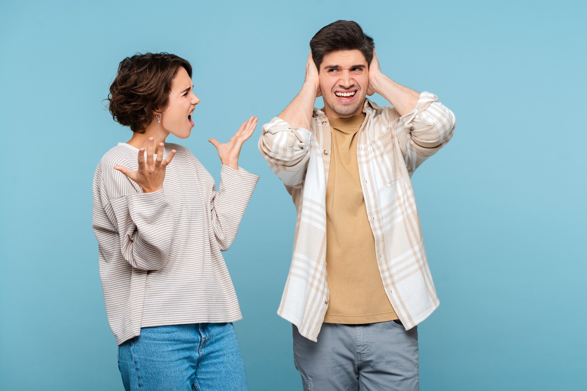 Portrait of couple, abuse woman, shouting loudly, quarrelling to young man